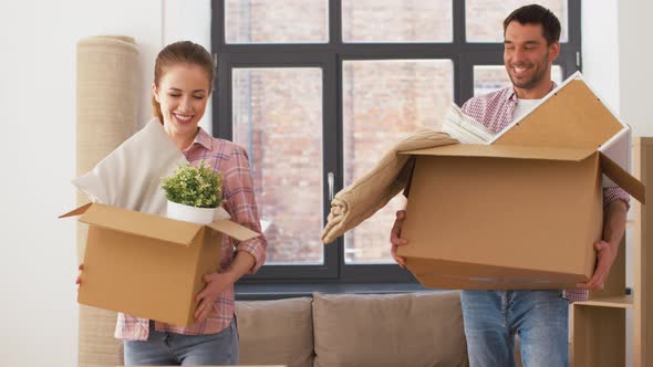 Couple Moving To New Home and Making High Five