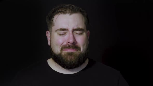 Motion studio portrait of a man becoming upset after receiving bad news