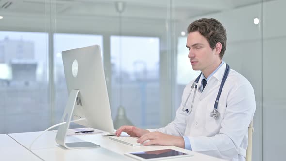 Serious Young Male Doctor Saying No with Finger Sign