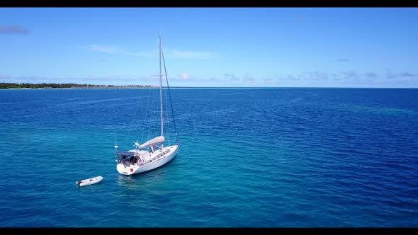 Aerial top down panorama of exotic sea view beach voyage by blue ocean with white sandy background o