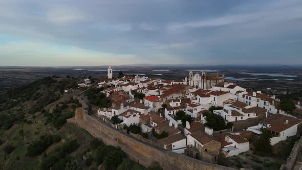 Drone flying over Monsaraz village at sunset, Portugal. Aerial panoramic view