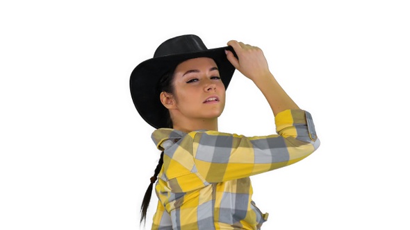 Young cowgirl dancing on white background.