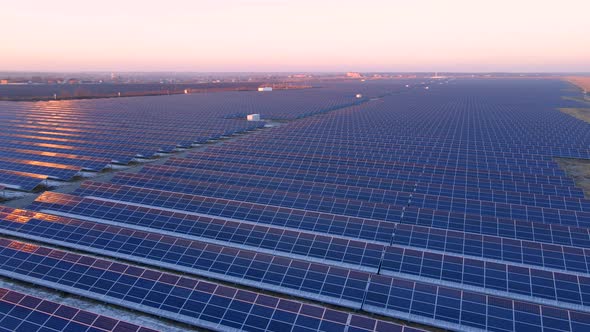 Aerial View of Solar Panels Stand in a Row in the Fields Power Ecology Innovation Nature Environment