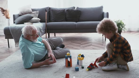 Grandparents plying with grandson.