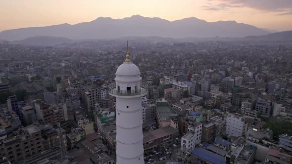 Aerial view over Kathmandu flying around the Dharahara Tower