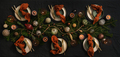 Flat-lay of Christmas table setting on dark table - PhotoDune Item for Sale