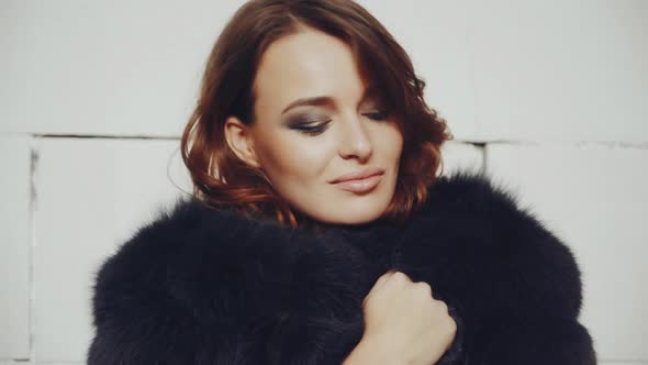 Portrait of glamour woman. Young fashionable woman posing in stylish wearing in studio