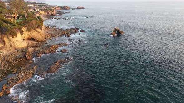 Flying over million dollar beach front luxury homes and a private beach in beautiful Laguna Beach Ca