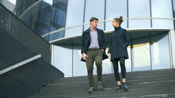 Business People Walking and Talking in the Street