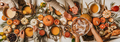 People eating over fall festive table set, top view - PhotoDune Item for Sale