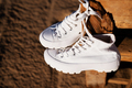 White sneakers on the beach - PhotoDune Item for Sale