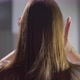 Young Woman Brushes and Touching Her Hair - VideoHive Item for Sale