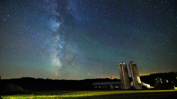 Milky Way Time Lapse Sliding Over Farm Silos and Field