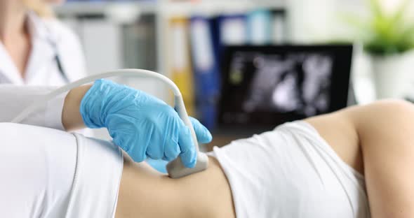 Medical Worker Examines Result of Ultrasound of Kidneys on Monitor