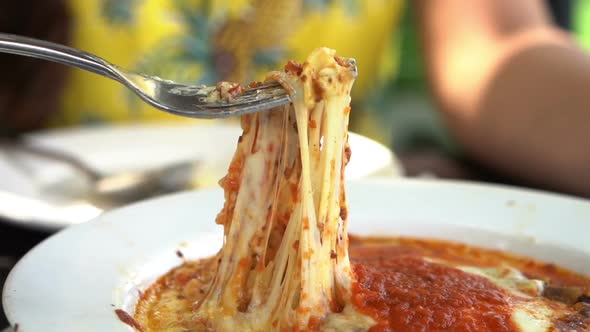 slow motion of  meat lasagna with fork