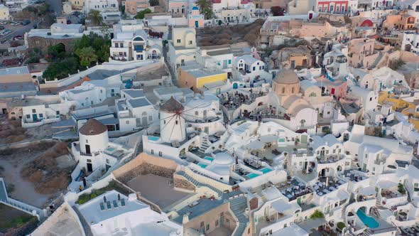 Aerial shot of famous Oia village in Santorini at sunrise in Greece.