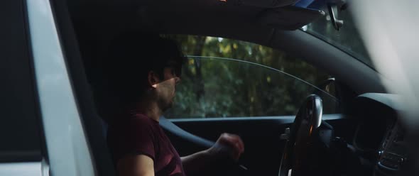 Man exits car to take photograph