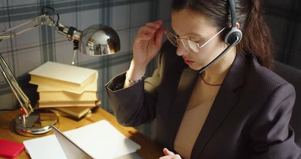 Woman Woman Working Long Hours  She Takes Off Her Eyeglasses