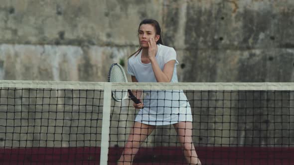 Woman playing tennis on a court