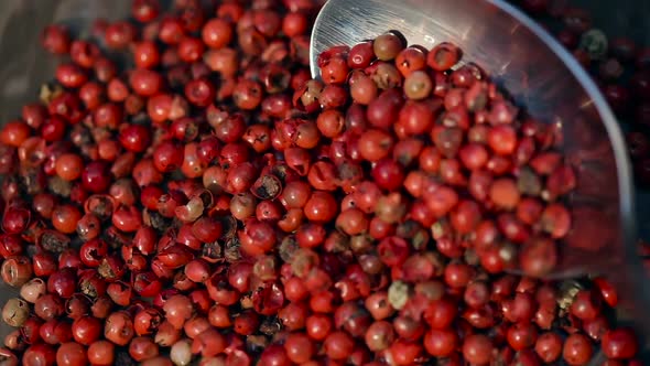 Rustic Red Peppercorn On Black Table