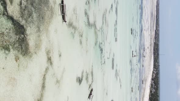 Vertical Video of Low Tide in the Ocean Near the Coast of Zanzibar Tanzania Aerial View