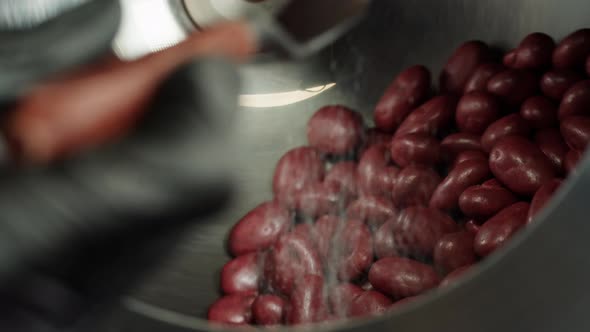 Almond in Chocolate Production of Nuts in Dark or Milk Chocolate