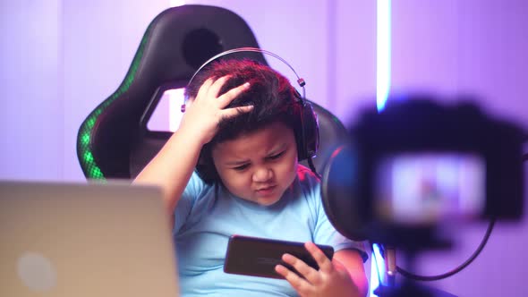 Asian Little Boy Playing Video Game With Mobile Phone Then Lose The Game While Live Stream