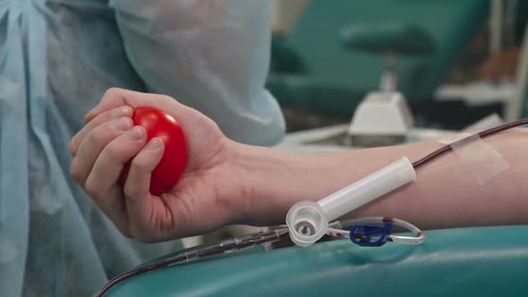 Squeezing Stress Ball during Taking Blood