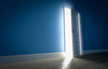 Light shining through open door in dark room with blue walls and wooden floor - PhotoDune Item for Sale