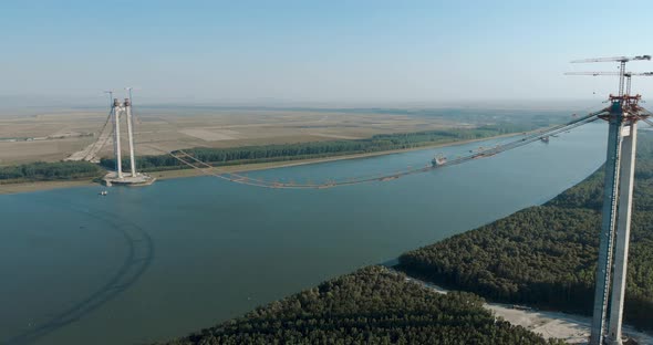 Danube River Spanned By Braila Bridge Under Construction With Towers And Main Cables