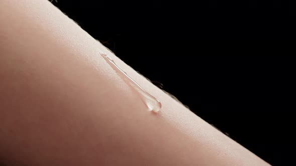 Hand Skin with Falling Water Drop Closeup