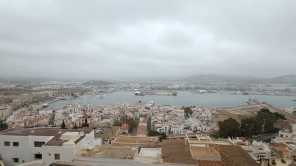 Pan Shot Over Tourist Ibiza City, Buildings Sunshine, Cloudy Day - Steady Shot