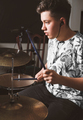 handsome teenager boy drummer playing on rehearsal in a studio. rock musician male teen - PhotoDune Item for Sale