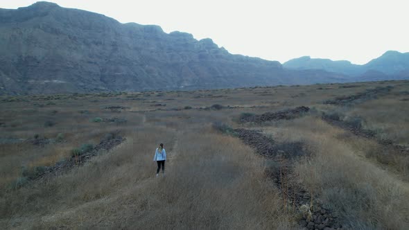 Ansite Fortress. Panoramic aerial shot of the Ansite Fortress with a young woman walking near the su