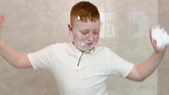 Funny Boy Dancing in a Bath with Shaving Cream on His Face