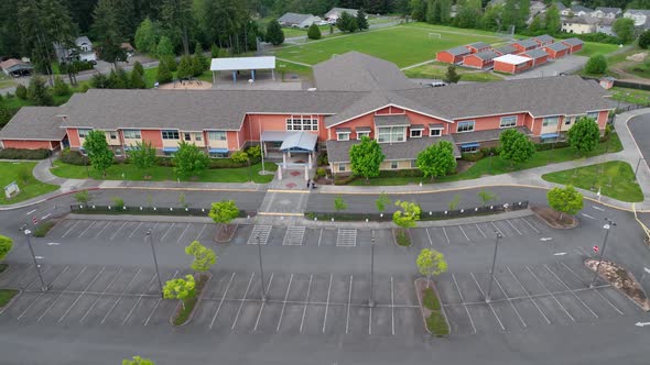 Aerial of a vacant elementary school during the summer.