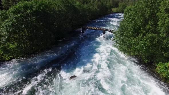 Flying above an old bridge on Norwegian river