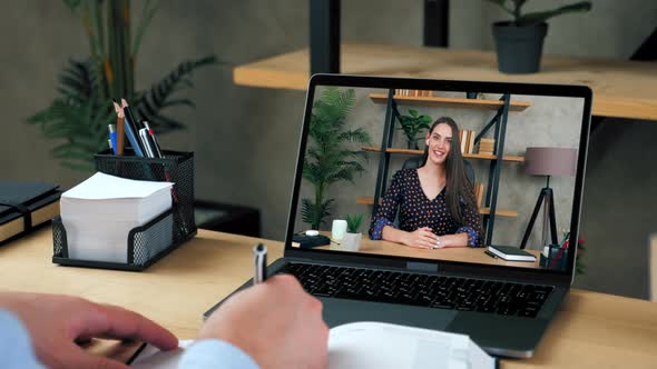 Smart woman tutor in laptop screen greets talk speak teaches by remote web cam