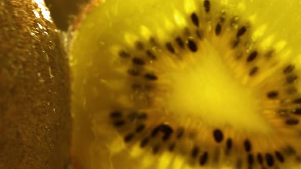 Rolling Half of Gold Kiwi and Opening the Inside of the Fruit in Slow Motion