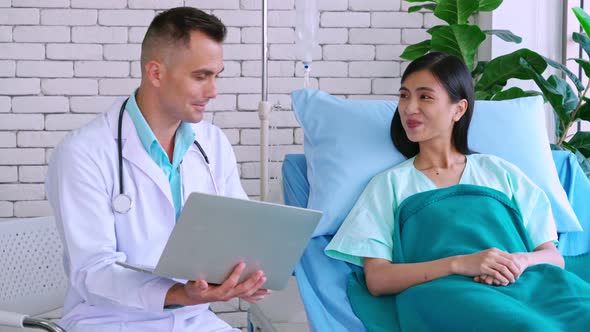 Doctor in Professional Uniform Examining Patient at Hospital