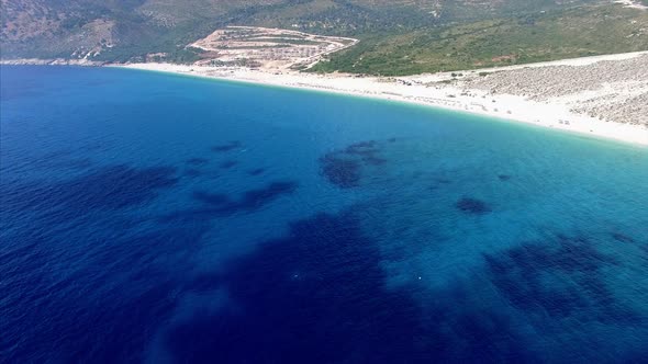 Aerial view of the beach with blue water