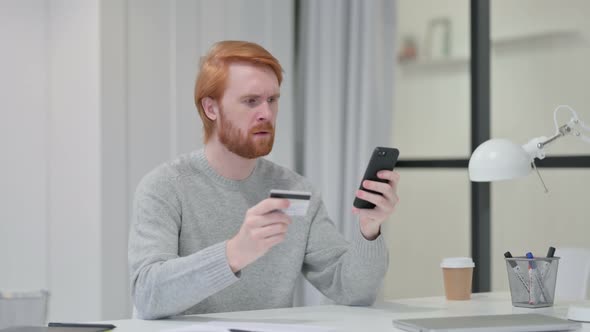 Redhead Man Upset By Online Shopping Failure on Smartphone 