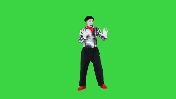 Mime Leans To Invisible Wall on a Green Screen Chroma Key