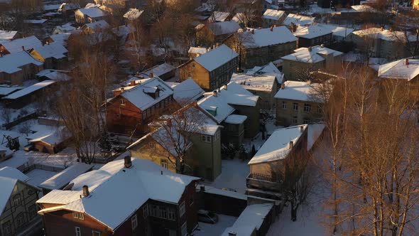 Drone shot of snowy Karlovas wooden houses