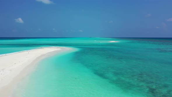 Wide angle overhead island view of a summer white paradise sand beach and aqua turquoise water backg