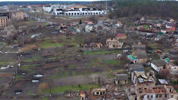 Aerial view of the destroyed and burnt houses. alt