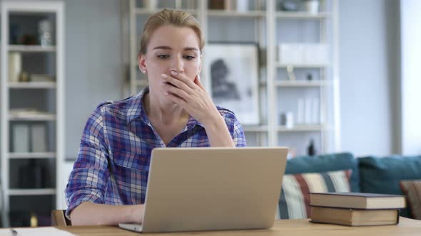 Wondering Woman in Shock While Working on Laptop