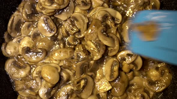 Frying Champignon Mushrooms in a Pan with Sunflower Oil, Diet Healthy Food