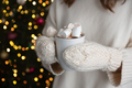 Woman holding a cup with cocoa and marshmallow - PhotoDune Item for Sale