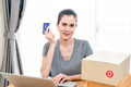Asian young woman sit in chair, while using laptop for shopping online  from home. - PhotoDune Item for Sale